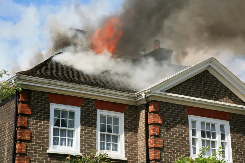 Ash Cleaning Essential. brown brick house on fire.